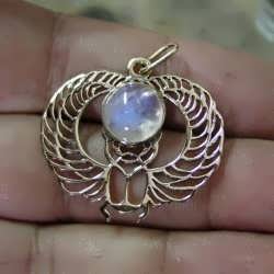 A finished 18k winged Egyptian Scarab set with moonstone