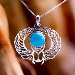 A silver Winged Egyptian Scarab set with turquoise