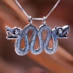 A silver Double Headed Serpent/Aztec Ouroboros set with diamonds