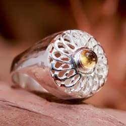A silver Torus Knot ring set with Citrine