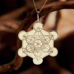 An engraving of Metatron's Cube in 14k gold.