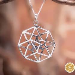A silver Tesseract pendant. A journey to the 4th dimension.