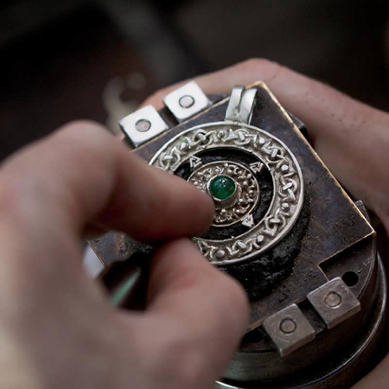 Setting a brilliant green Emerald in a Norse Amulet talisman