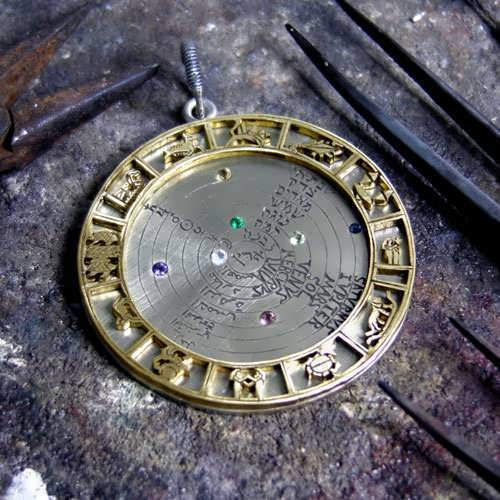 Image of the Cosmos Talisman silver and gold